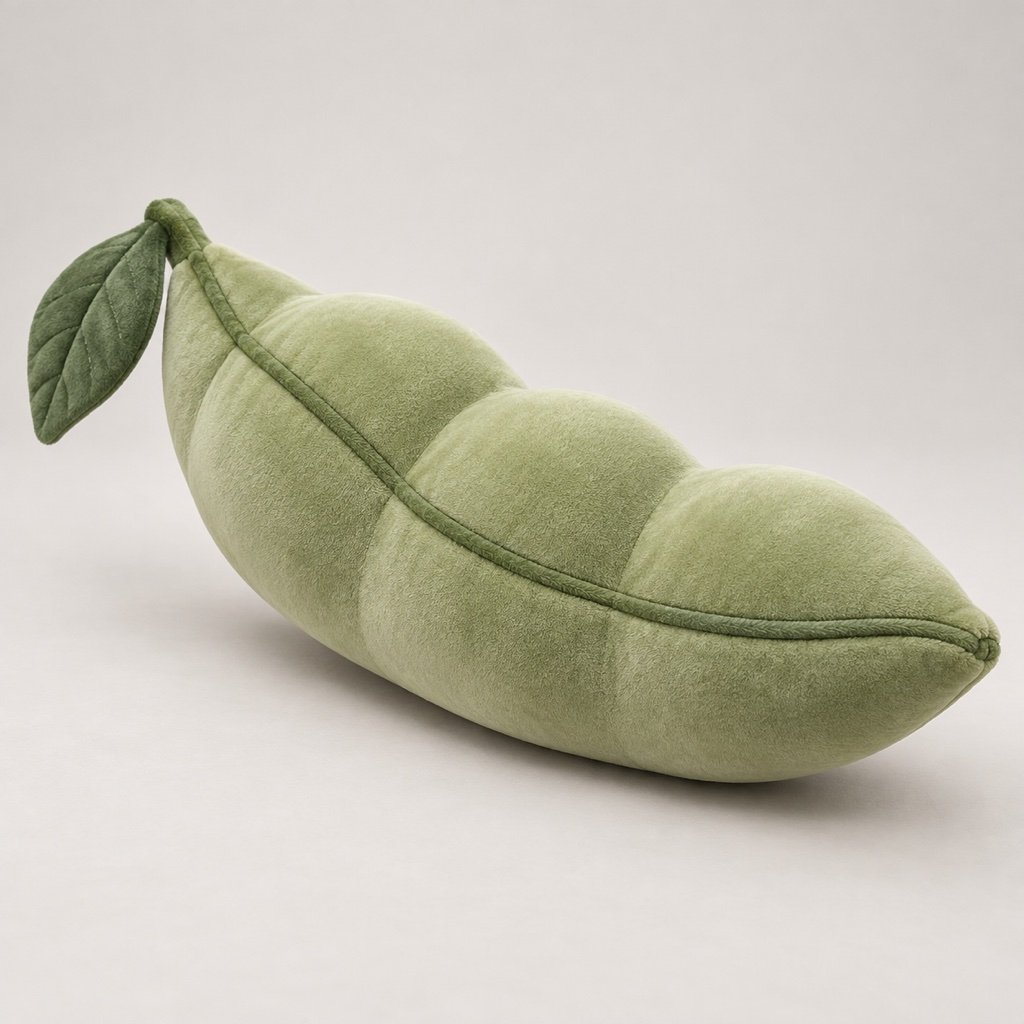 Closed green pea pod plush design concept with rounded contours, a curved seam and an attached leaf detail